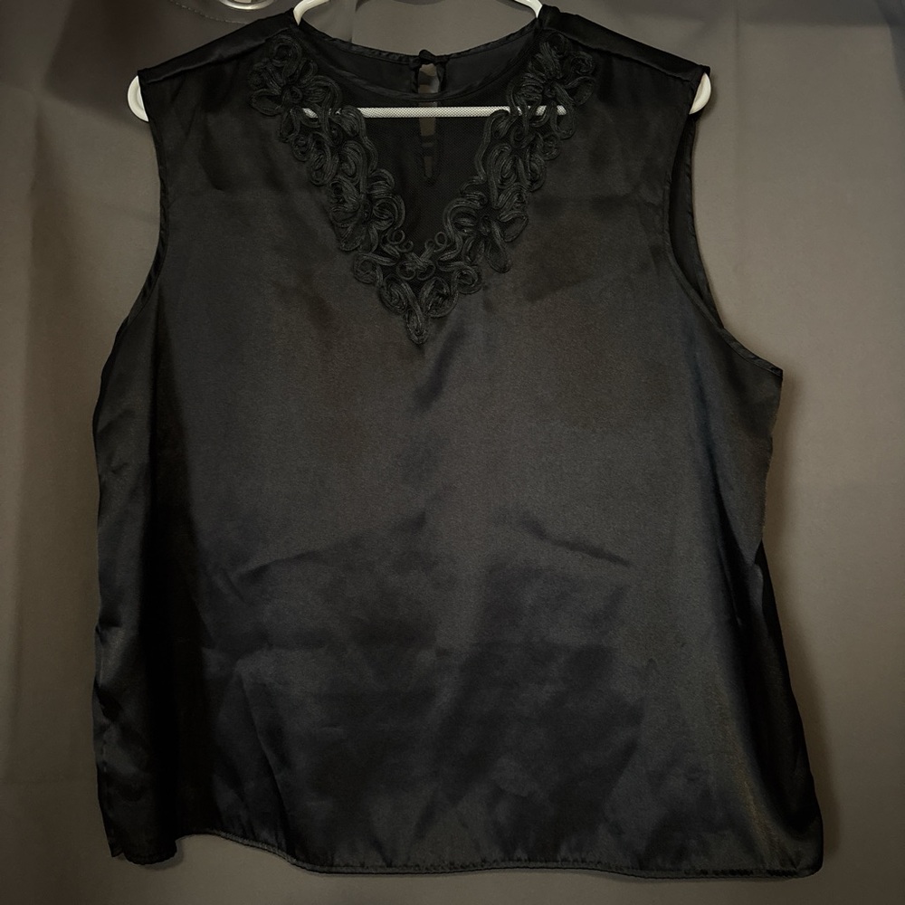 Elegant Black Sleeveless Top with Embroidered Neckline